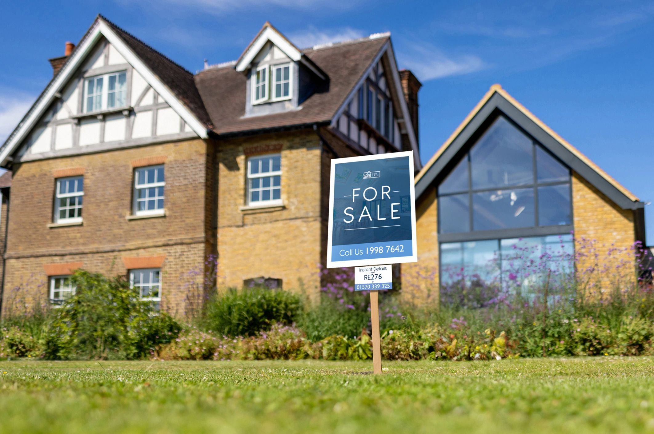 House for sale with a real estate sign in the front yard
