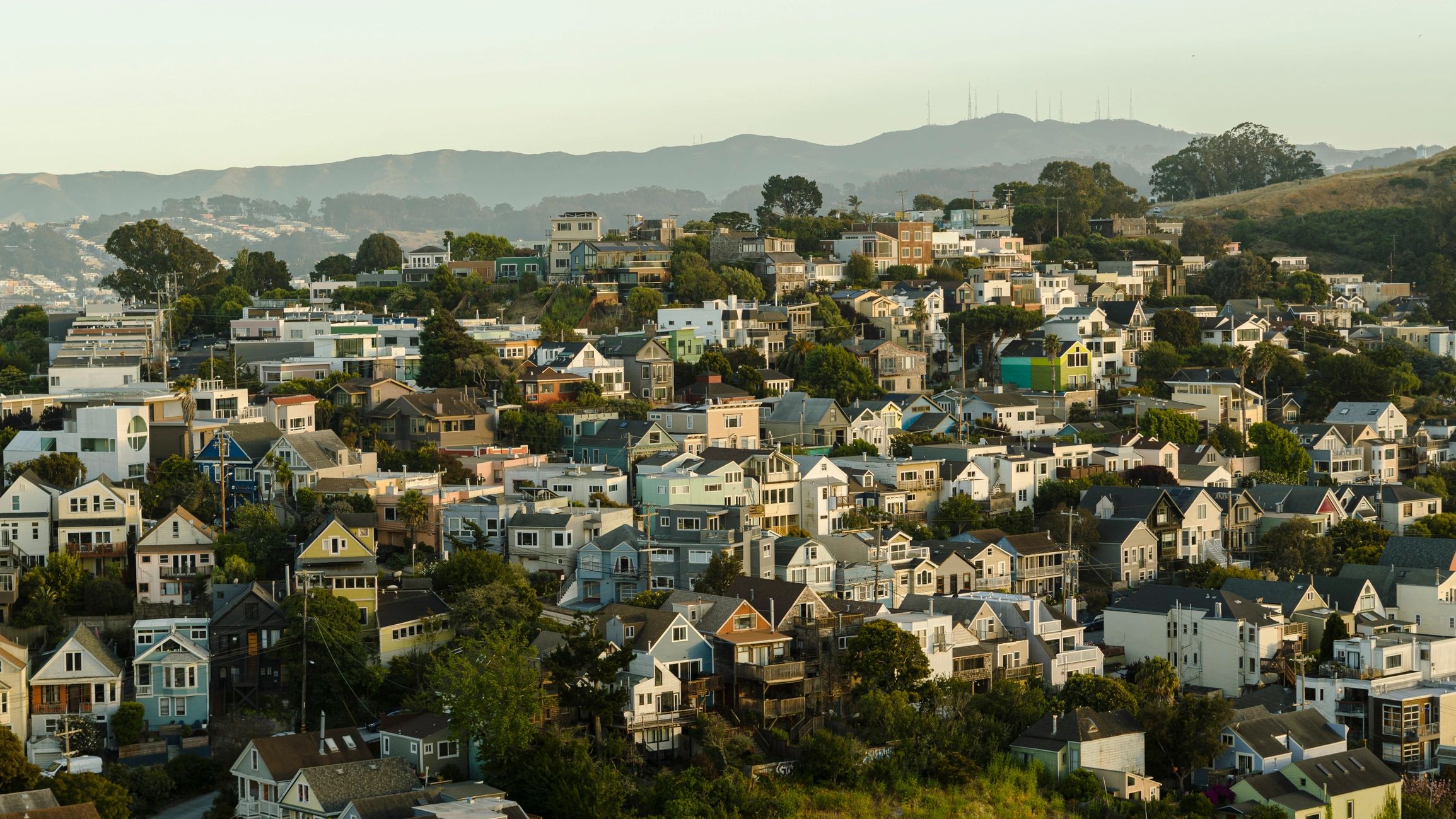 Dense neighborhood homes across a hillside community